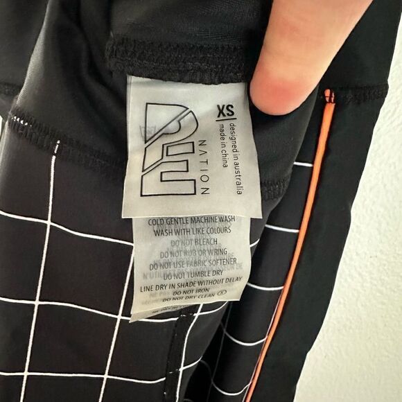 P.E Nation The Hammer Throw Legging Black/White Graph Paper Print Orange Piping - Picture 10 of 12